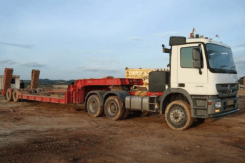 Flatbed trailer carrying steel and building material
